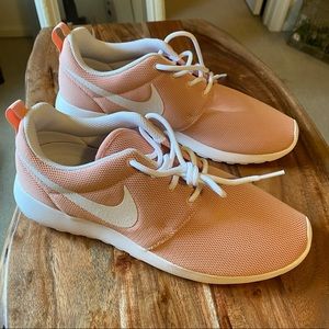 Brand new pink Nike running shoes.